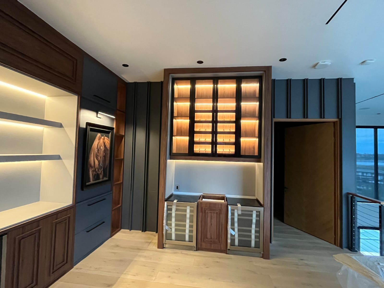 Dark luxury custom kitchen in walnut with dramatic lighting